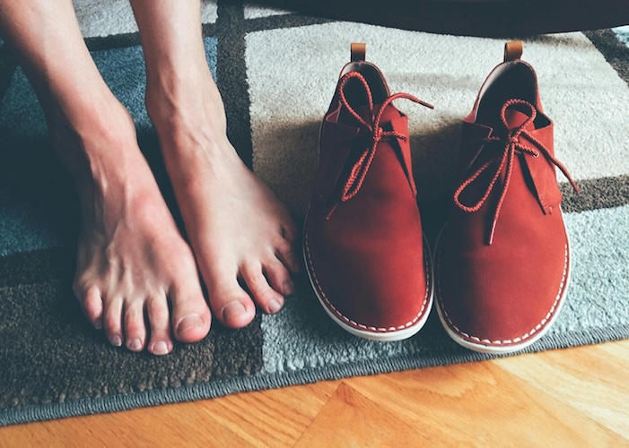 bare feet and red shoes